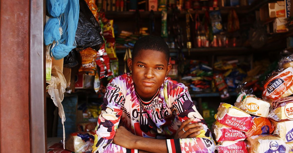 A young entrepreneur at a market stall in Abuja, Nigeria